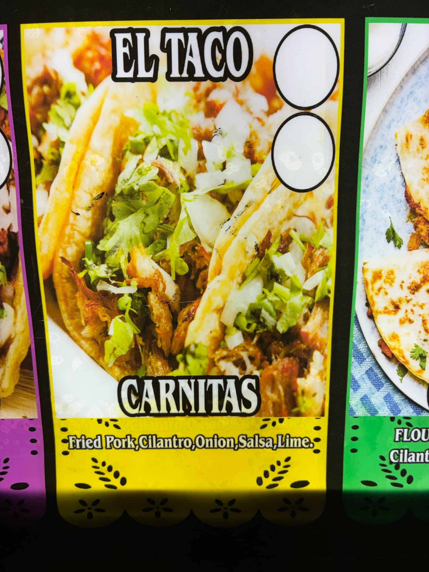 Carnitas tacos served with cilantro, onion, salsa, and lime